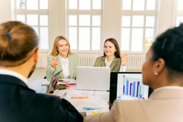 Creative business team working and collaborating in a modern office setting.